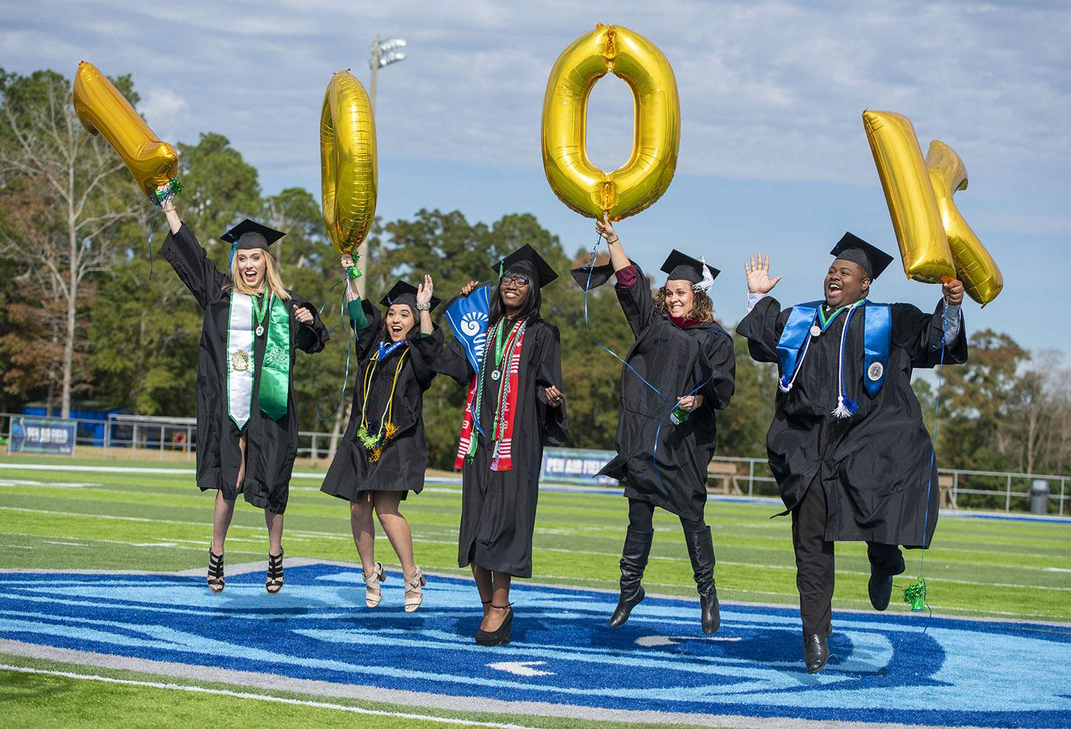 Fall 2018 graduates celebrating UWF's 100,000th degree
