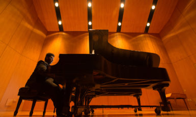 James Matthews and Bolton Eilenberg (back) practice Tchaikovsky's Piano Concerto no. 1, first movement in the Music Hall at the Center for Fine & Performing Arts at the University of West Florida