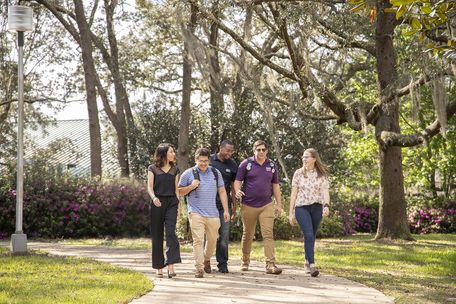 UWF students socializing on their way to class