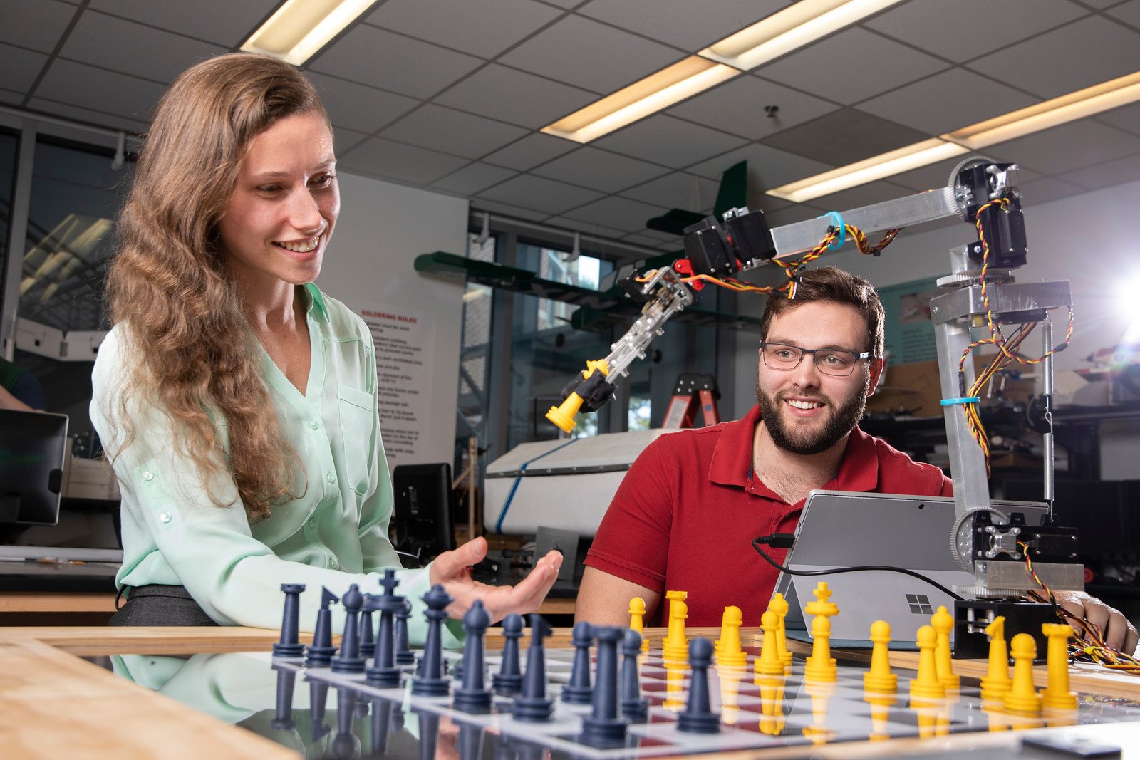 UWF engineering students working on a mechatronics project in the Hal Marcus College of Science and Engineering