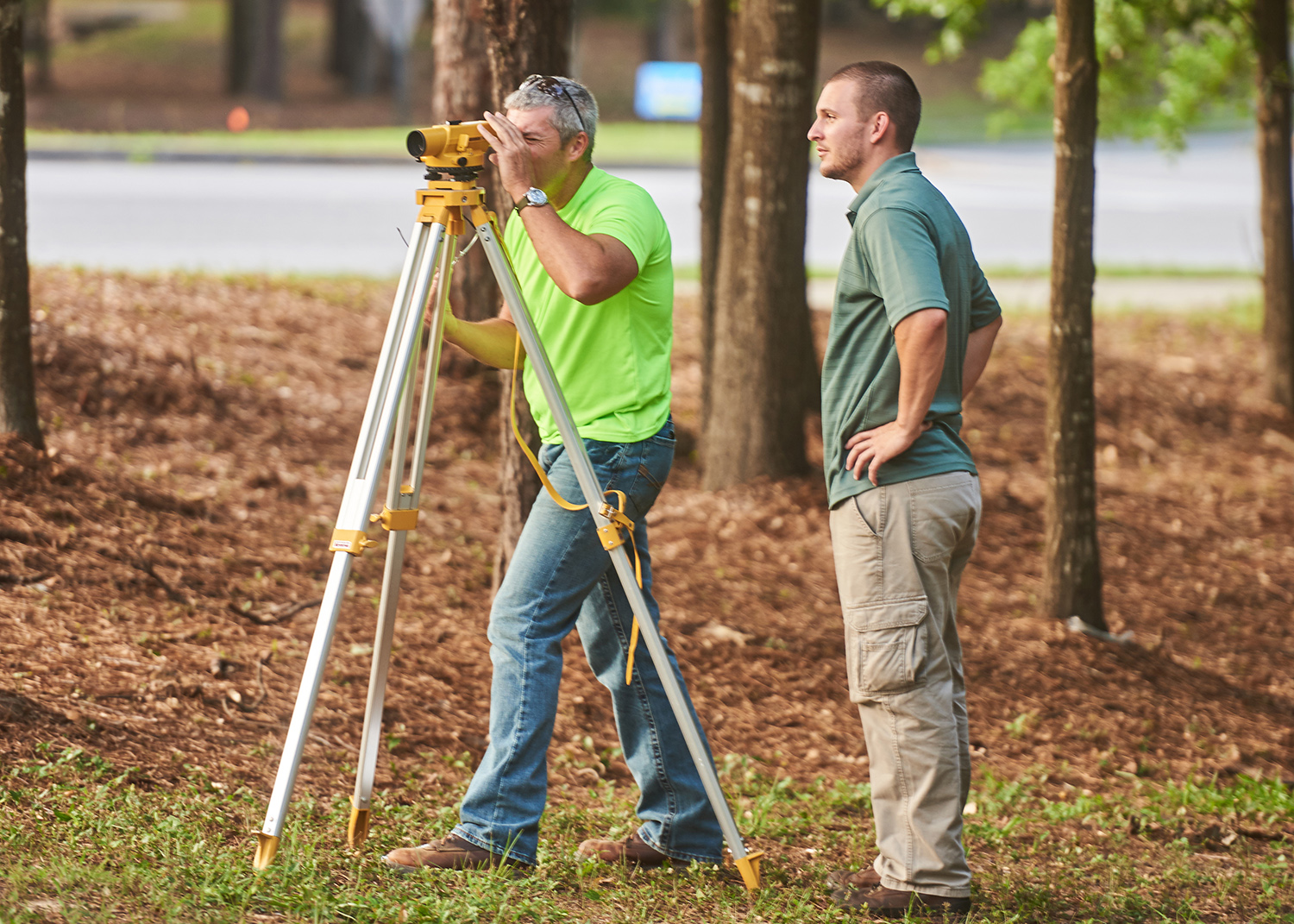 Dr. Nye Grant's class practices surveying techniques on the University of West Florida's main campus.