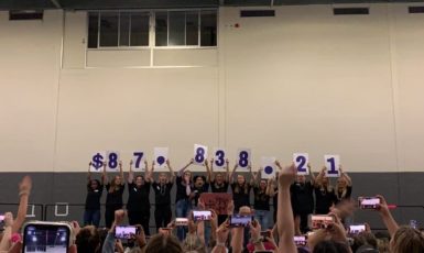 Dance Marathon 2020 executive members holding up the numbers "$87,838.21"