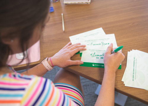 UWF faculty sign greeting cards for nursing home residents on March 27, 2020 in Crosby Hall, Building 10.