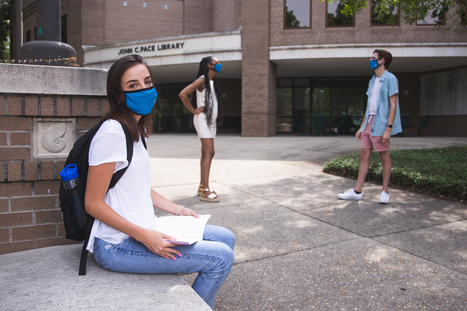 UWF students venture about campus while wearing face protection on Aug. 19, 2020.