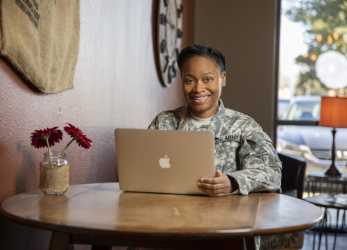 A UWF military student studying and completing coursework at the Coffee Break Cafe coffee shop in Pace, Florida on Monday, Jan. 28, 2019. Thanks to UWF's online course offerings, students can take courses and earn a university degree no matter where they may be.