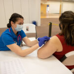 UWF nursing students aid local Florida Deptartment of Health officials by administering COVID-19 vaccinations at a vaccination facility in Milton, Florida, on Mar. 17, 2021.