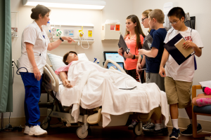 Nursing student Gloria Malpica works with participants taking part in an exercise that was part of CRASH camp. 