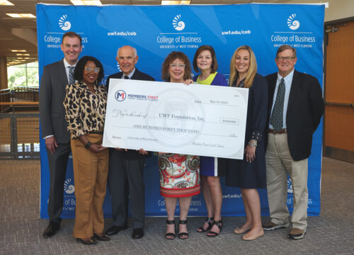 Members First Credit Union of Florida donated a gift of $140,000 to the UWF Foundation at the College of Business on May 10, 2022.