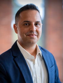 Dr. Brian Jalaian outdoor headshot.