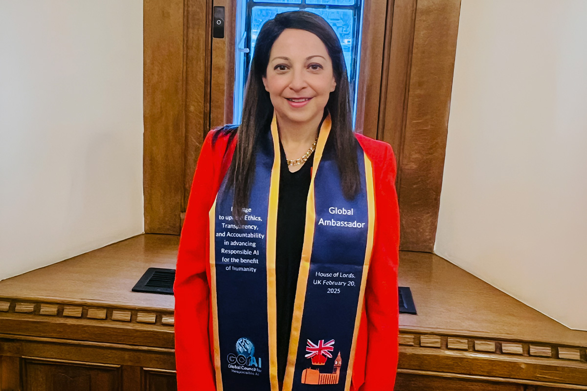 Dr. Eman El-Sheikh smiles with a stole around her neck