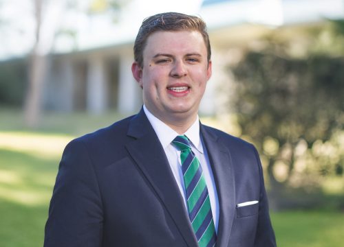 Professional headshot of Alex Smith, new Executive Director of External affairs for UWF