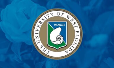 University of West Florida President's Seal with nautilus shell in a shield over a magnolia tree