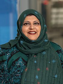 Sajida Shabanali indoor headshot.