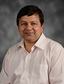 Dr. Amitabh Mishra indoor headshot.