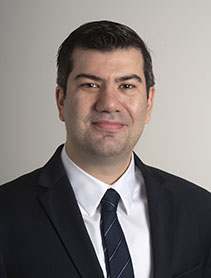 Dr. Hakki Erhan Sevil indoor headshot.