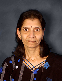 Dr. Lakshmi Prayaga indoor headshot.