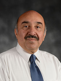 Dr. Raid Amin indoor headshot.