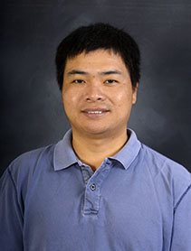 Xingang Fang indoor headshot.