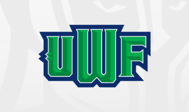 Graphic: Letters UWF in bold green letters with navy blue outline. Argonaut helmet in the background.