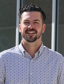Dr. Cody Karl Reinhardt outdoor headshot.
