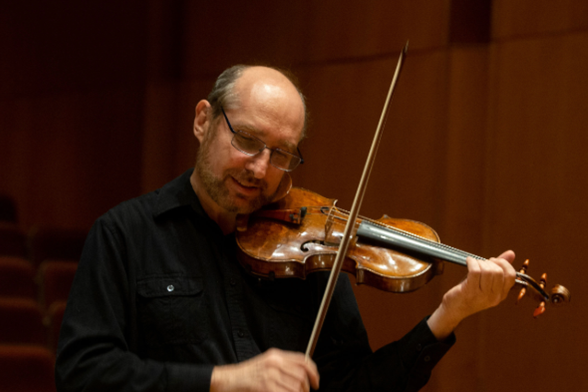 Person plays a violin.